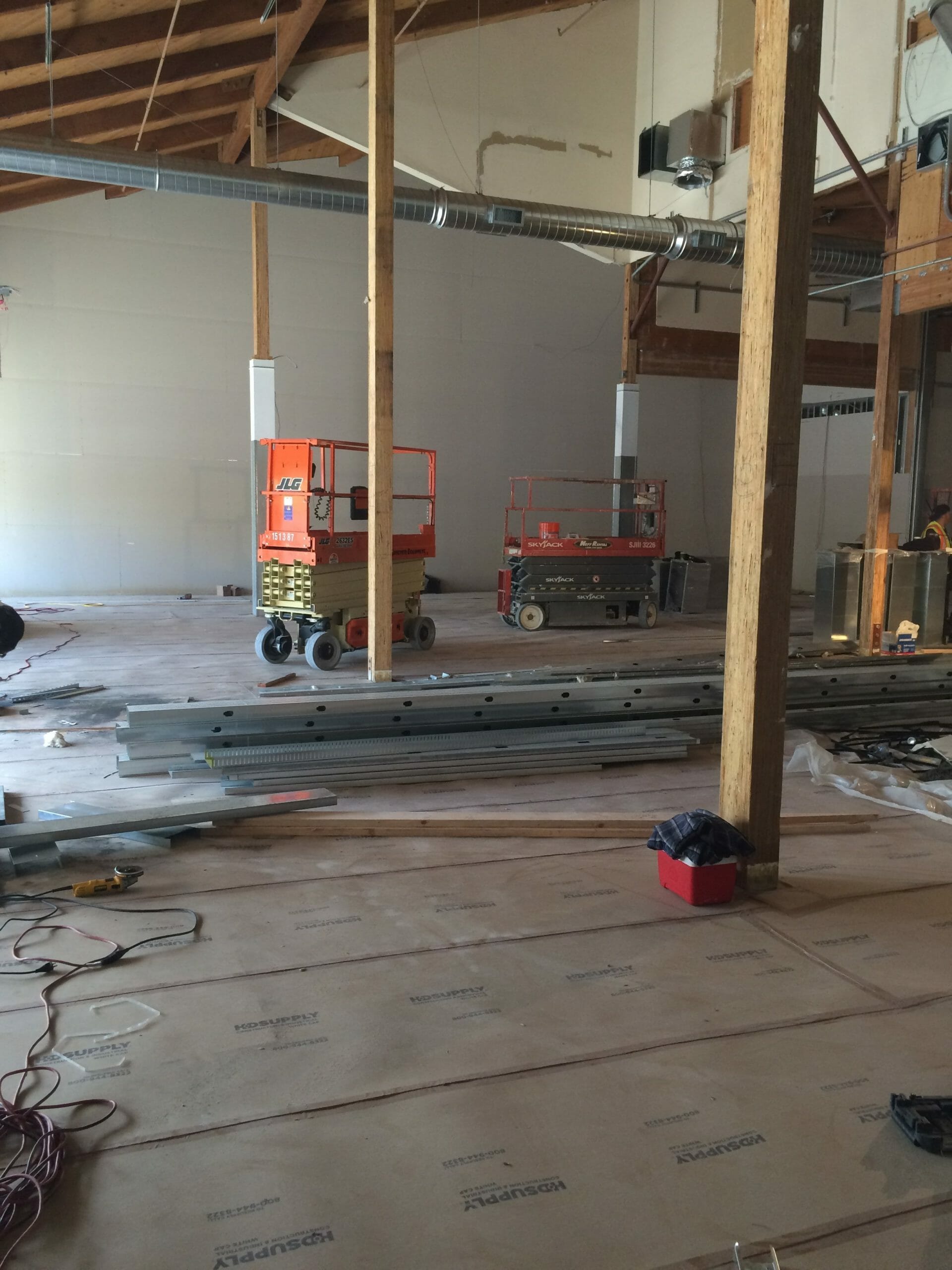 Scissor lifts under conduit being installed