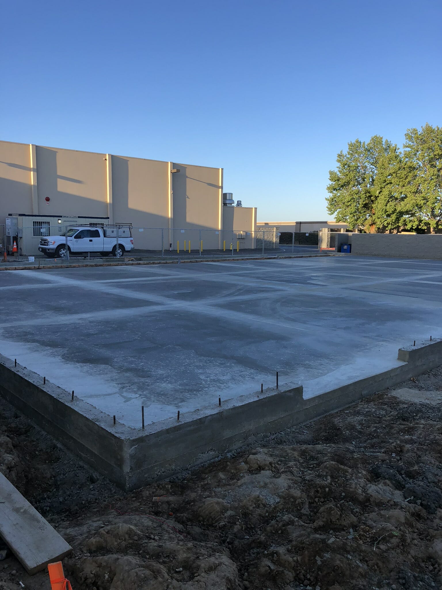 finished concrete pour with truck in background