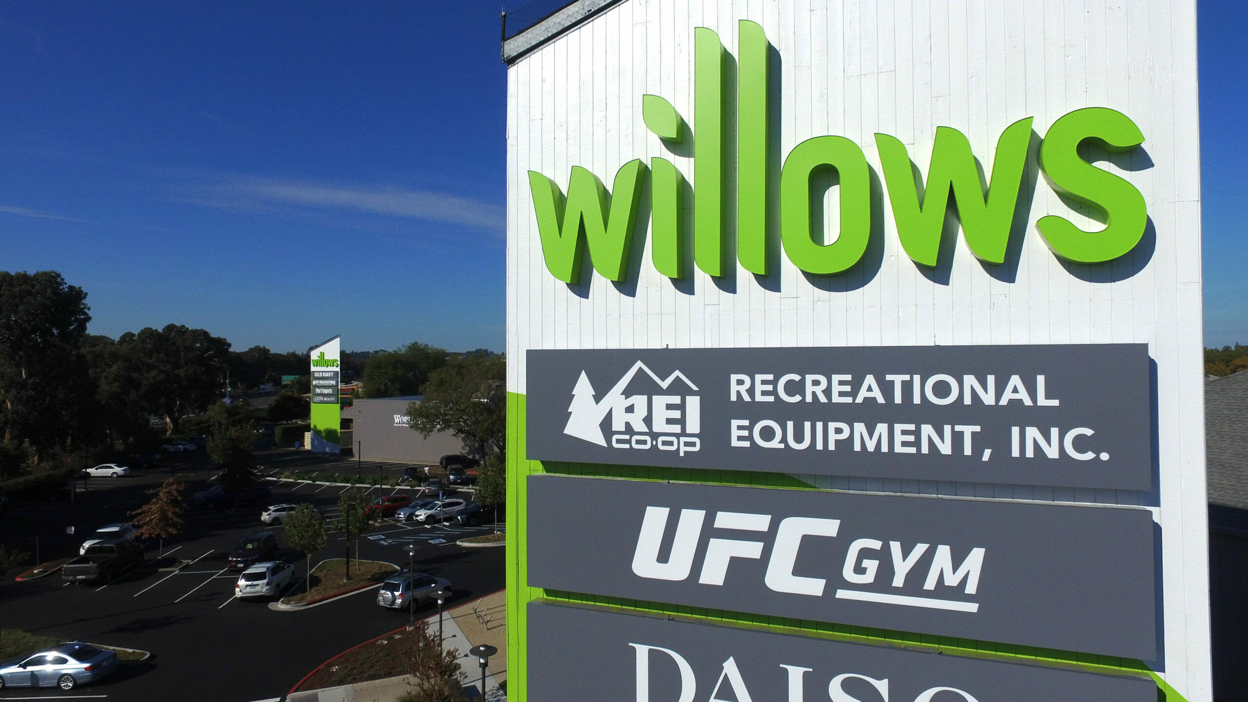 Willows Shopping Center sign green letters